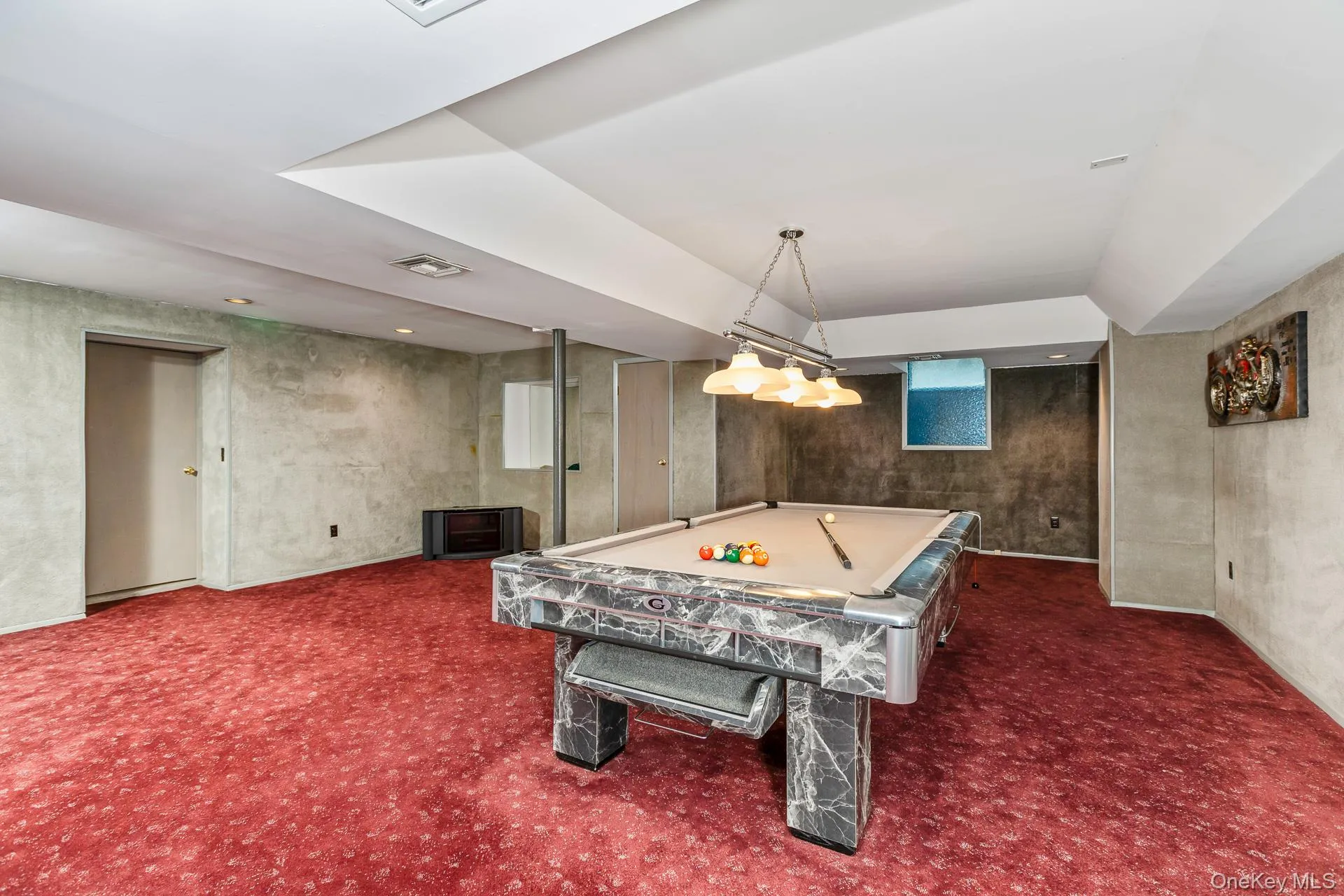 Recreation room with carpet floors and pool table Recreation room with carpet floors and pool table