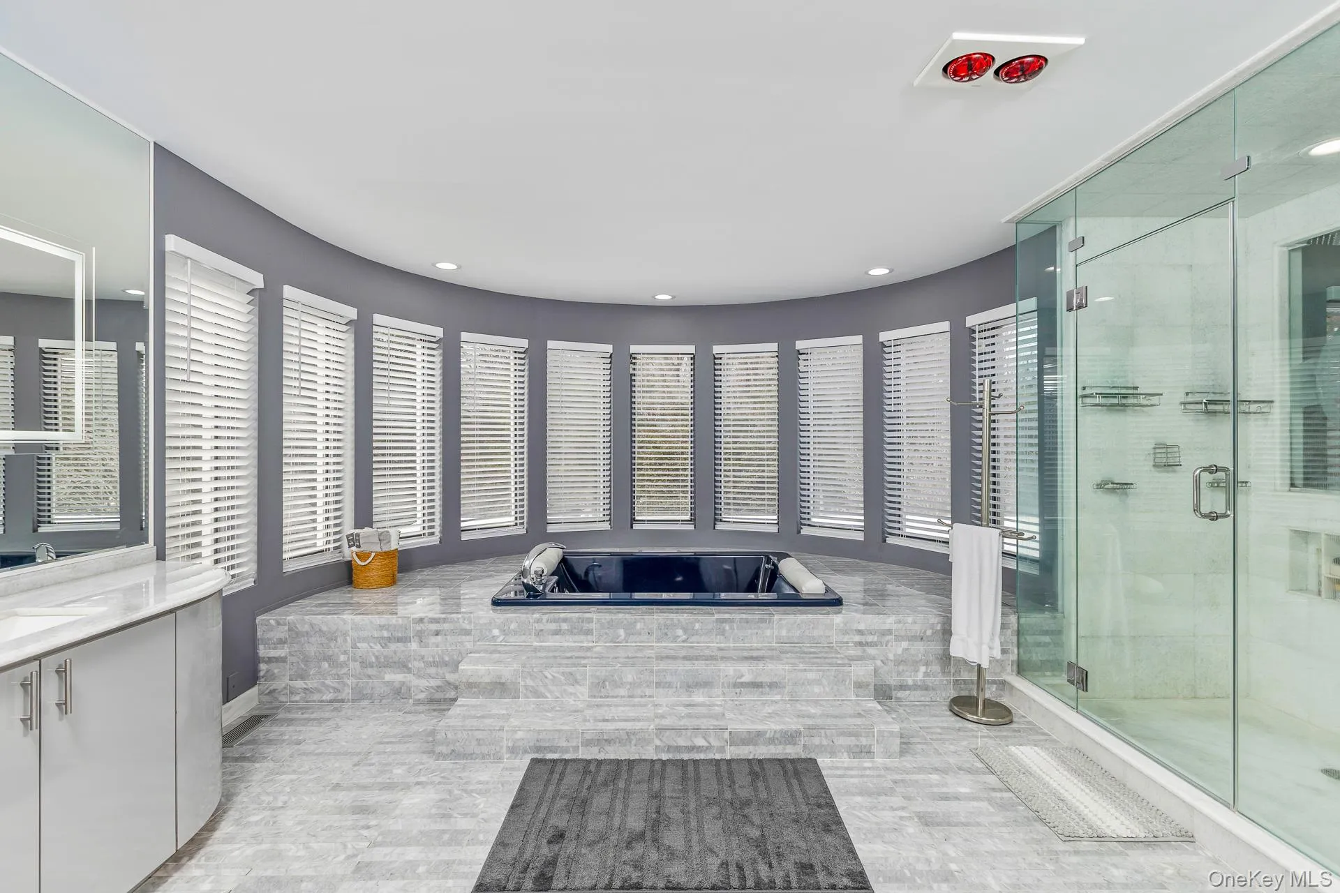 Full bathroom featuring a shower stall, a bath, and vanity Full bathroom featuring a shower stall, a bath, and vanity