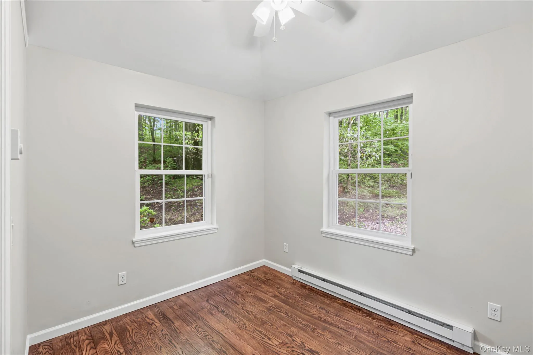 Alternate view of bedroom #2 -enjoys views of the side and backyard. Alternate view of bedroom #2 -enjoys views of the side and backyard.