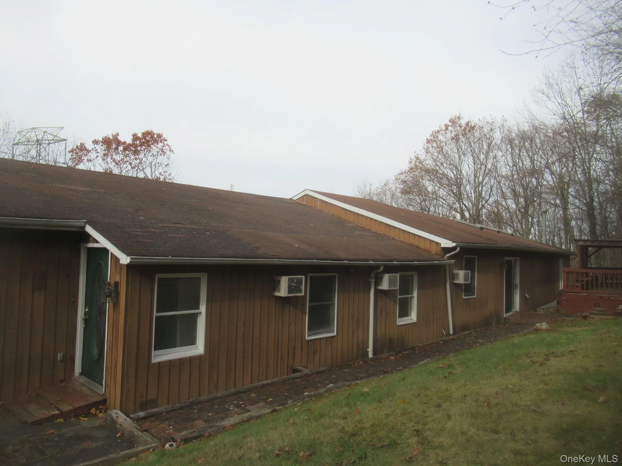 View of side of property featuring a lawn View of side of property featuring a lawn