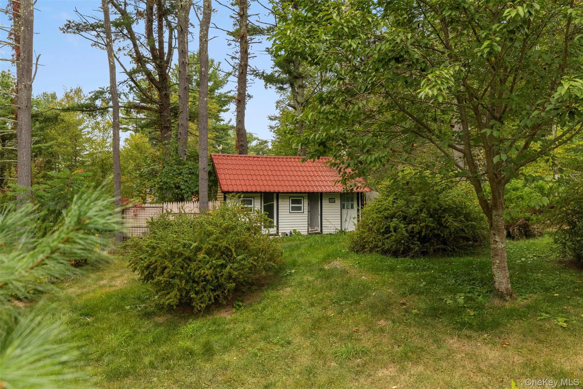View of front of home featuring a tiled roof View of front of home featuring a tiled roof