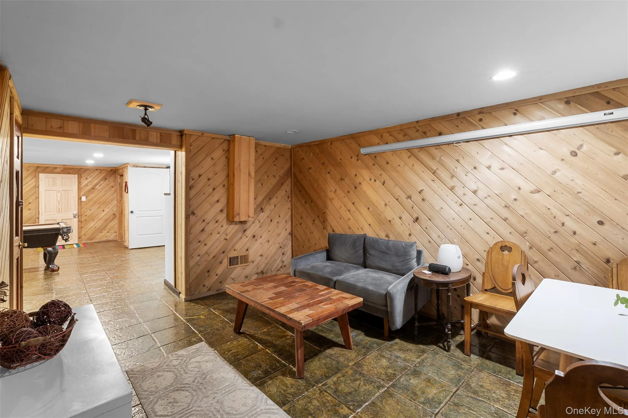 Living area featuring wood walls, pool table, and recessed lighting Living area featuring wood walls, pool table, and recessed lighting