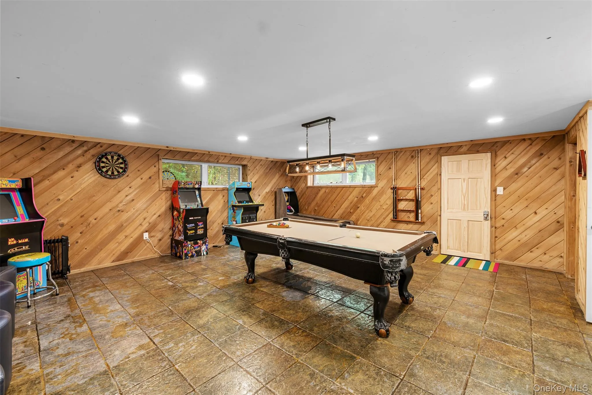 Rec room with wood walls, billiards, and recessed lighting Rec room with wood walls, billiards, and recessed lighting