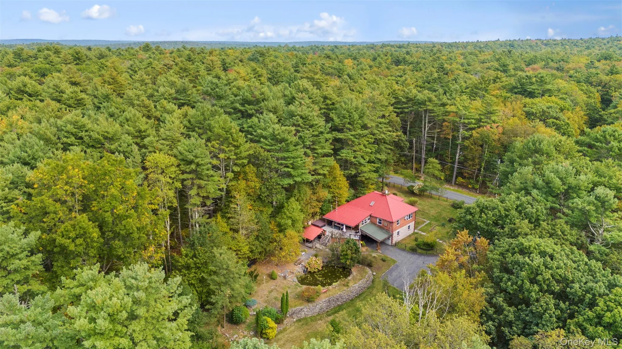 View from above of property featuring a forest View from above of property featuring a forest