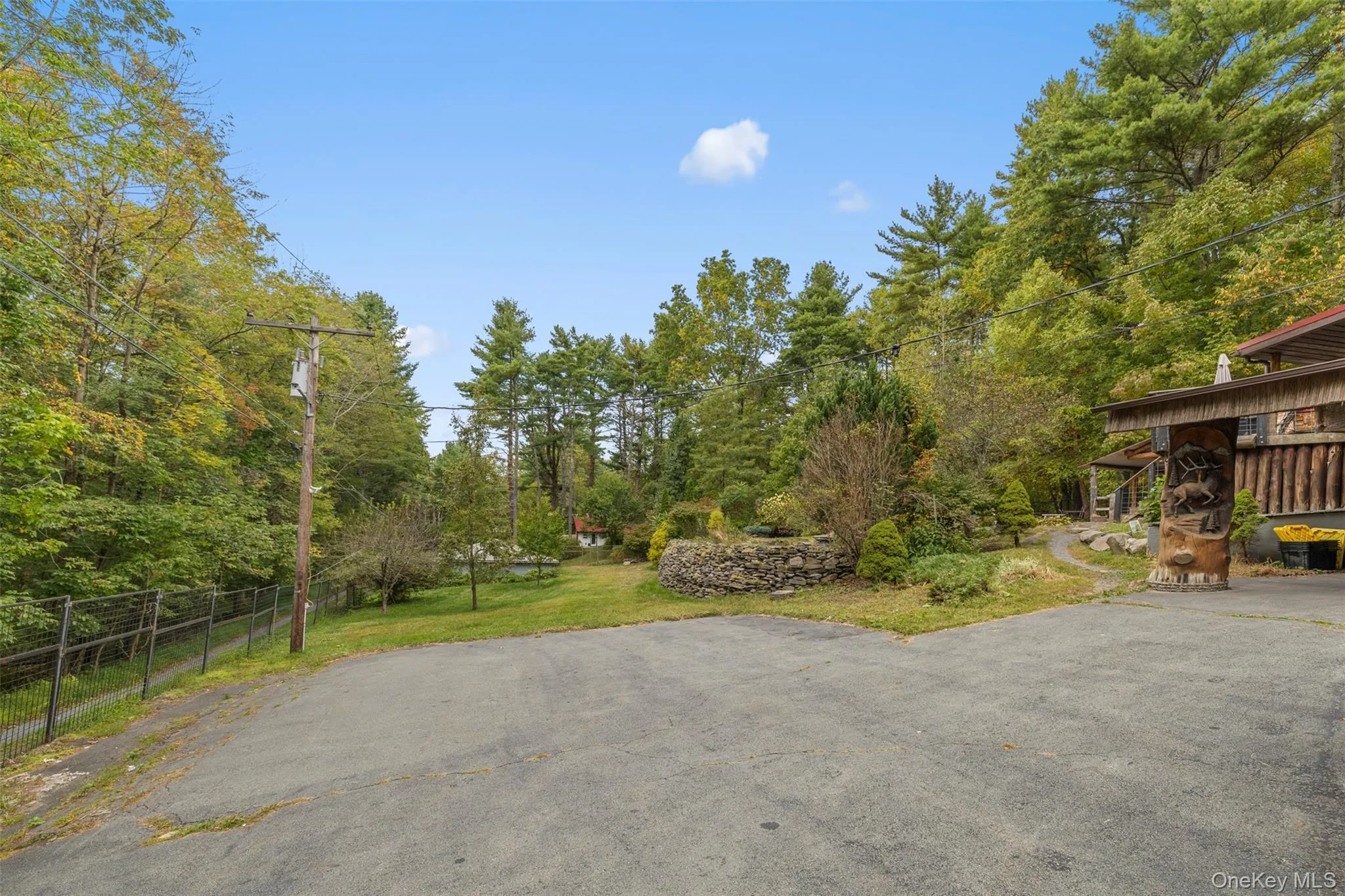 View of patio featuring view of wooded area View of patio featuring view of wooded area