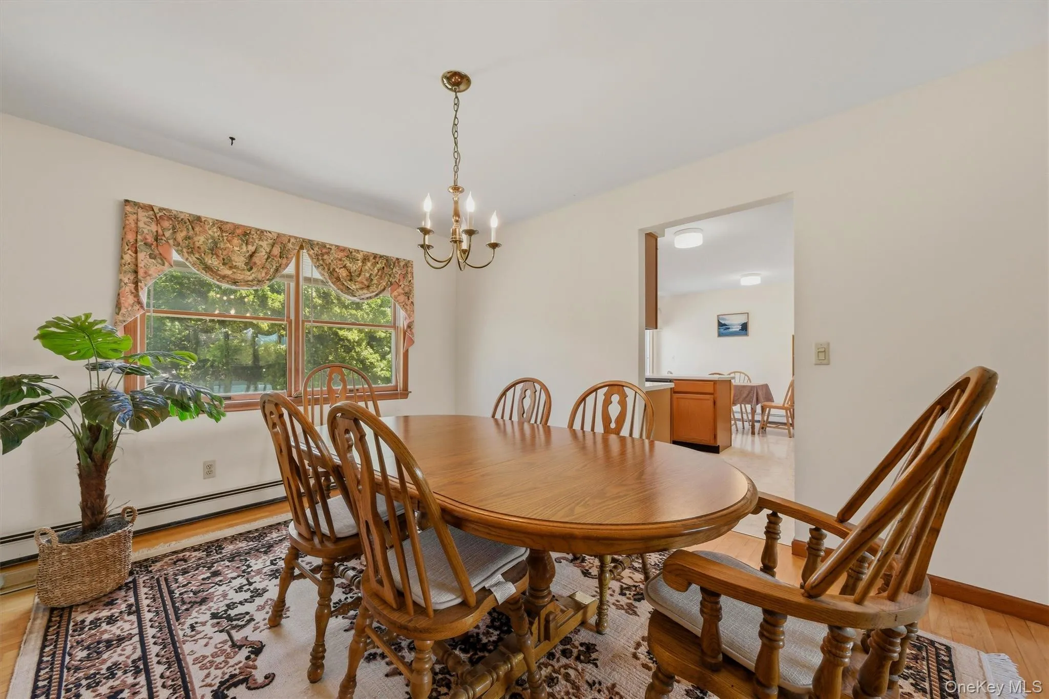 Formal dining room and entry to kitchen Formal dining room and entry to kitchen