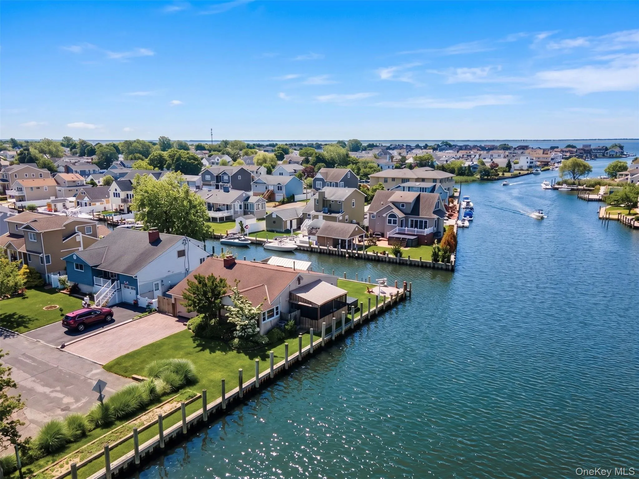 Waterfront property featuring extensive canal frontage with boat docks Waterfront property featuring extensive canal frontage with boat docks
