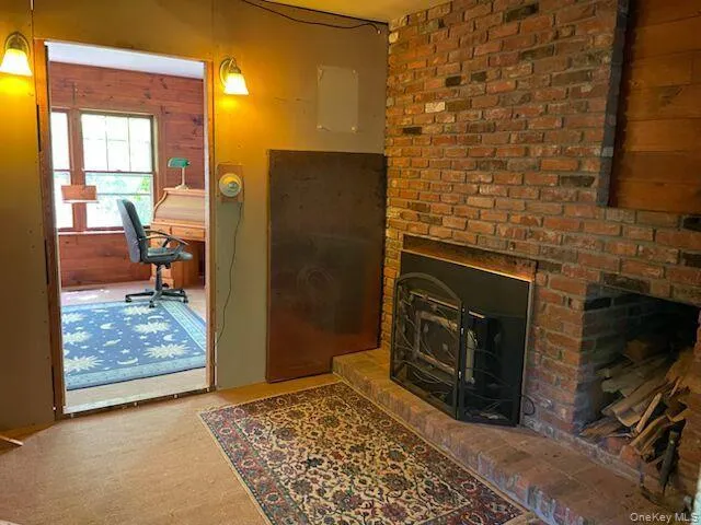 Den with brick fireplace insert Den with brick fireplace insert