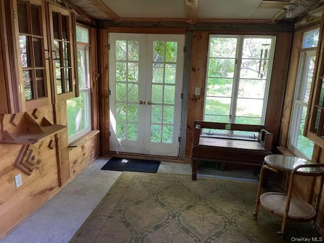 3 season room off of den with path to screened-in porch 3 season room off of den with path to screened-in porch