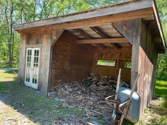 Wood shed at side of home Wood shed at side of home
