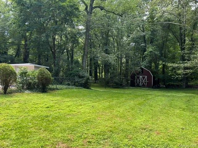 Tree filled acreage surround the home Tree filled acreage surround the home