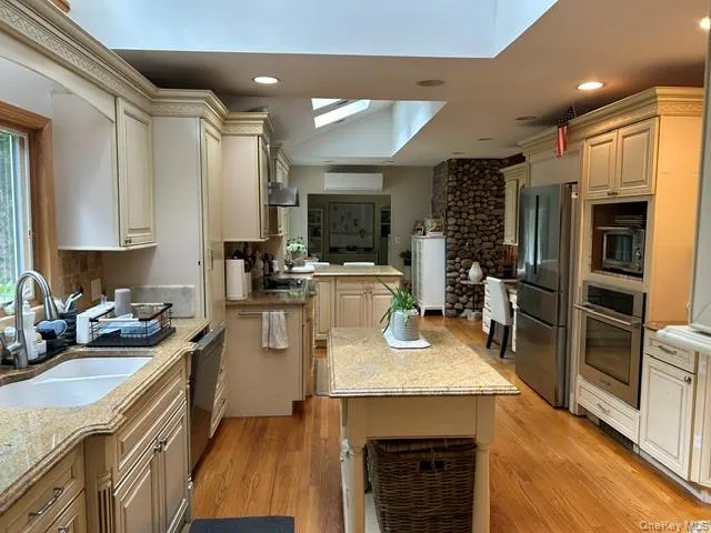 Full view of an expansive kitchen with removable island Full view of an expansive kitchen with removable island
