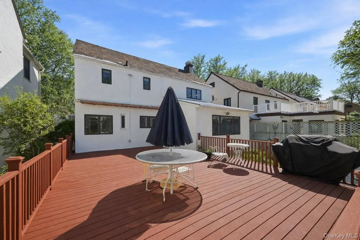 Trex deck with table and chairsGas grill provided Trex deck with table and chairsGas grill provided