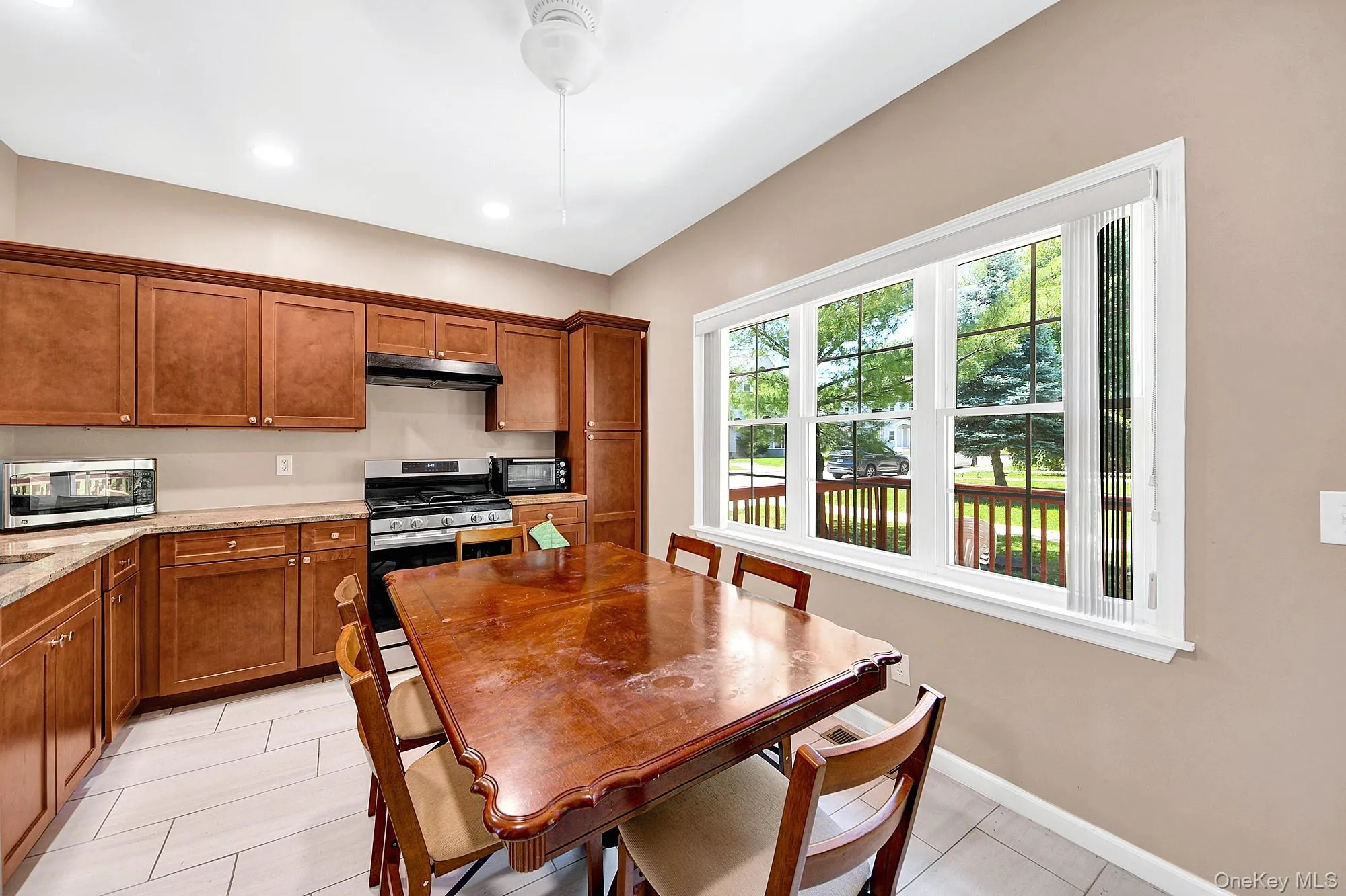 Large eat-in kitchen with hardwood cabinets, granite counter tops and stainless steel appliances Large eat-in kitchen with hardwood cabinets, granite counter tops and stainless steel appliances