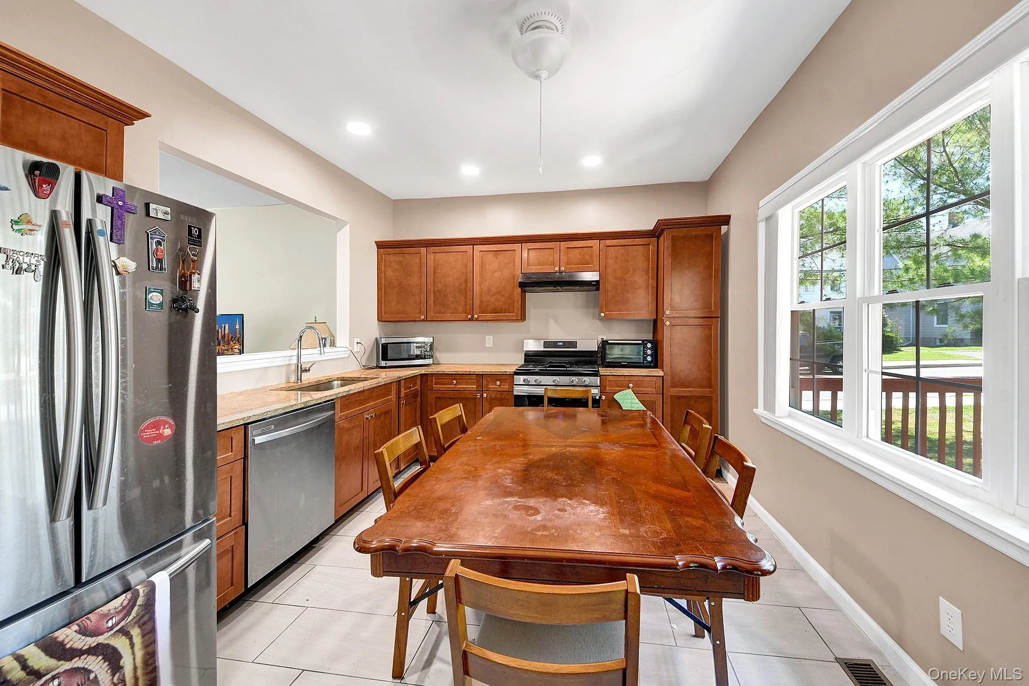 Large eat-in kitchen with hardwood cabinets, granite counter tops and stainless steel appliances Large eat-in kitchen with hardwood cabinets, granite counter tops and stainless steel appliances