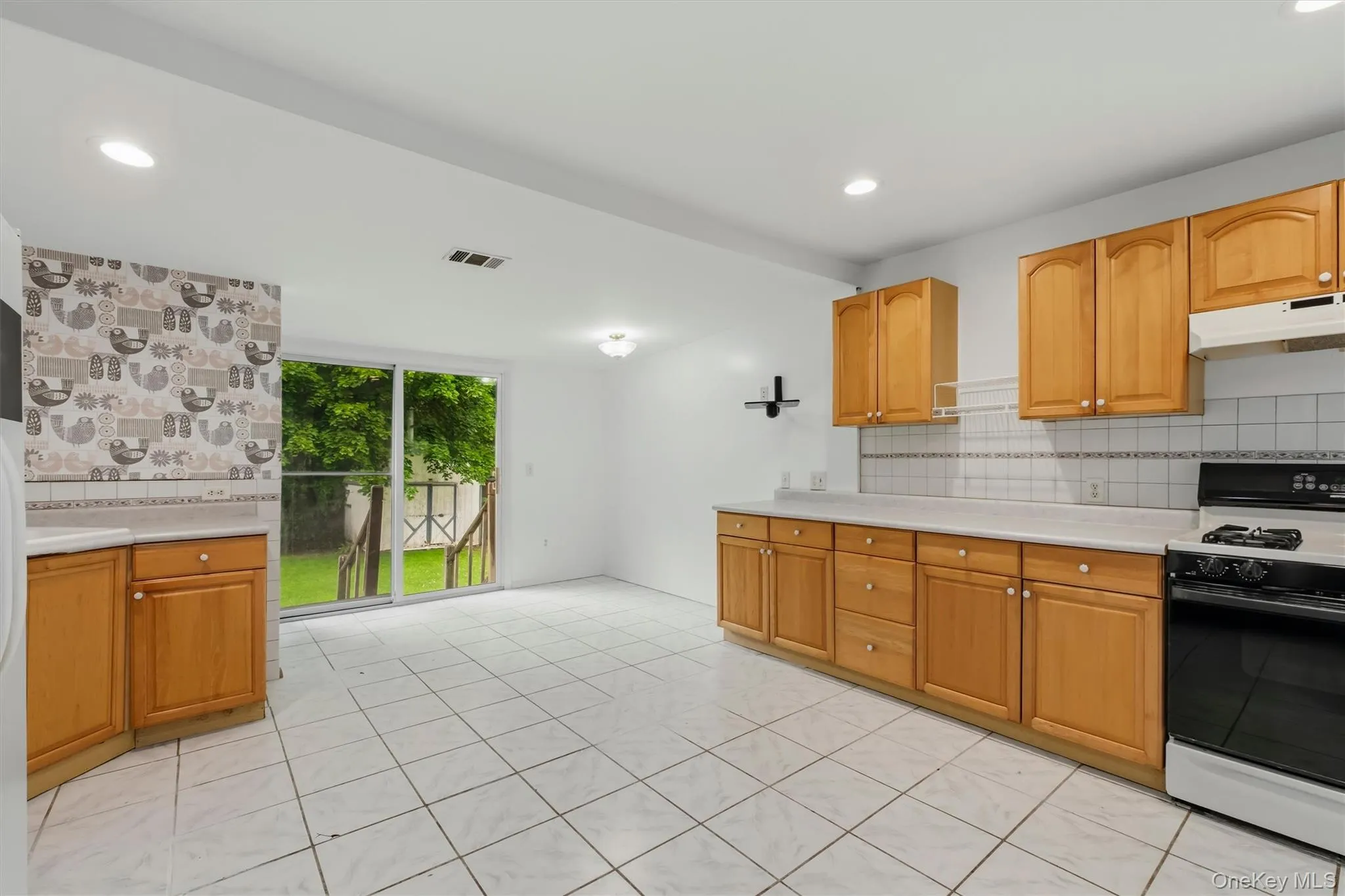 Kitchen with view to private backyard Kitchen with view to private backyard