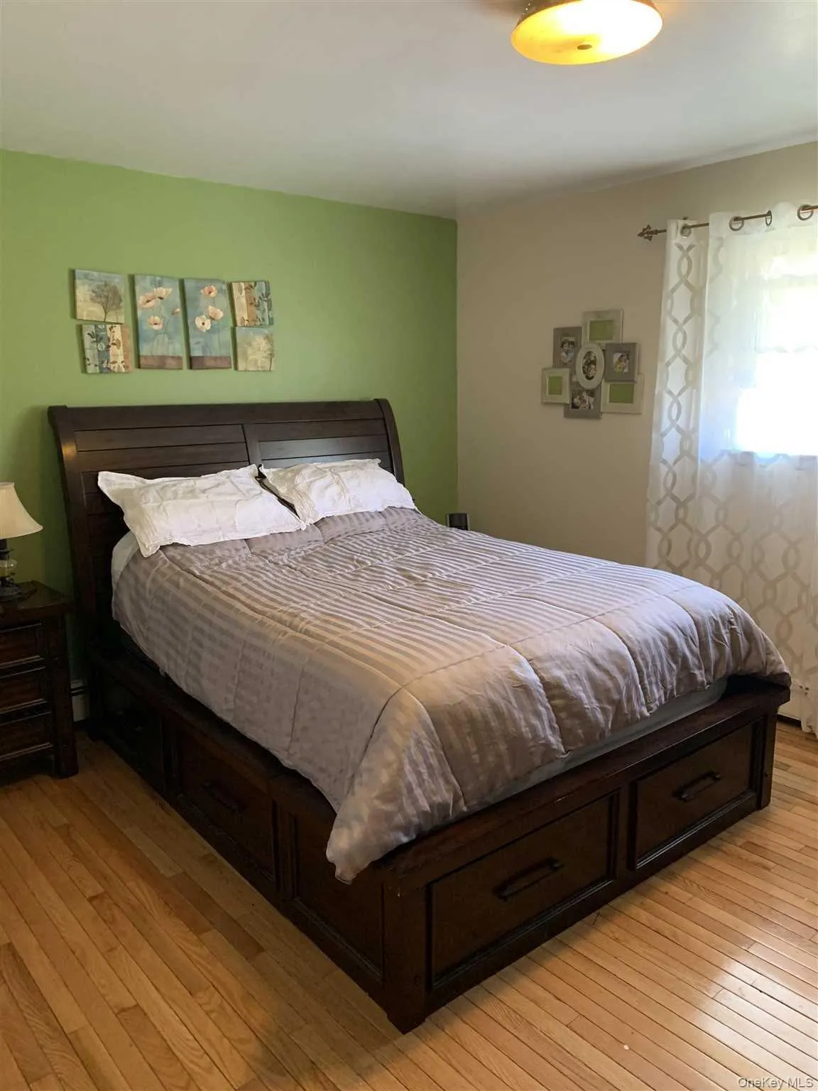 Primary Bedroom with Wood Floors Primary Bedroom with Wood Floors