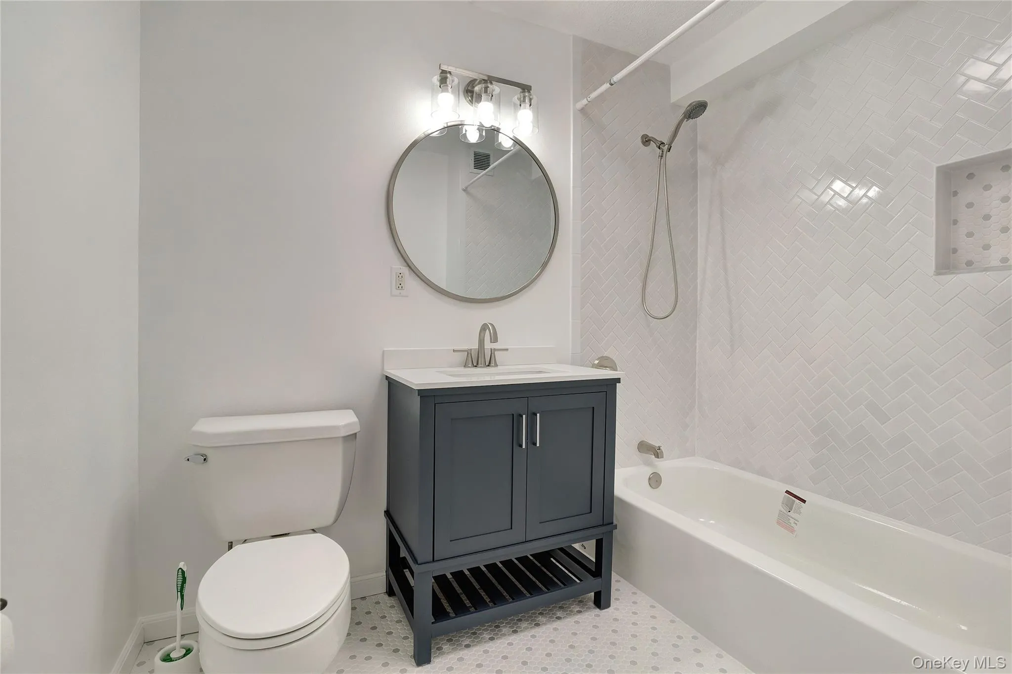 Bathroom featuring washtub / shower combination and vanity Bathroom featuring washtub / shower combination and vanity