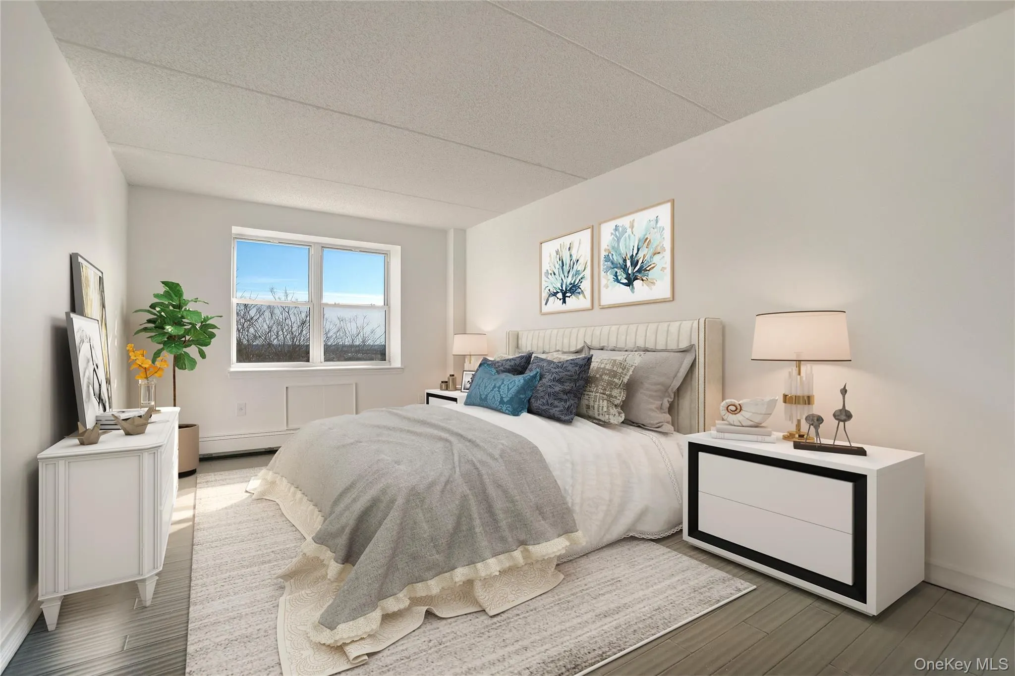Bedroom featuring a textured ceiling and wood finished floors Bedroom featuring a textured ceiling and wood finished floors