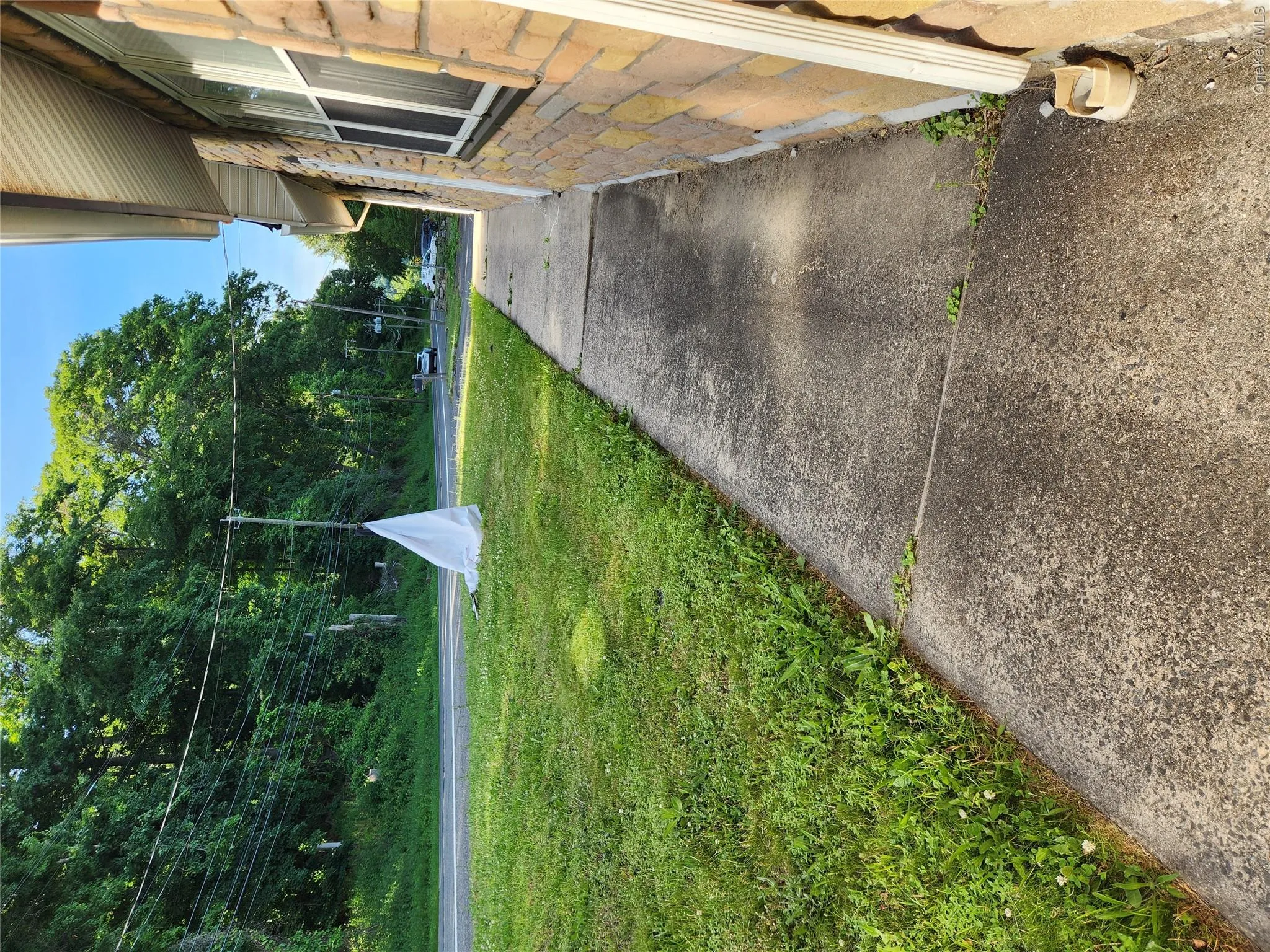 Level sidewalk from parking to front door. Easy access for people with limited mobility Level sidewalk from parking to front door. Easy access for people with limited mobility