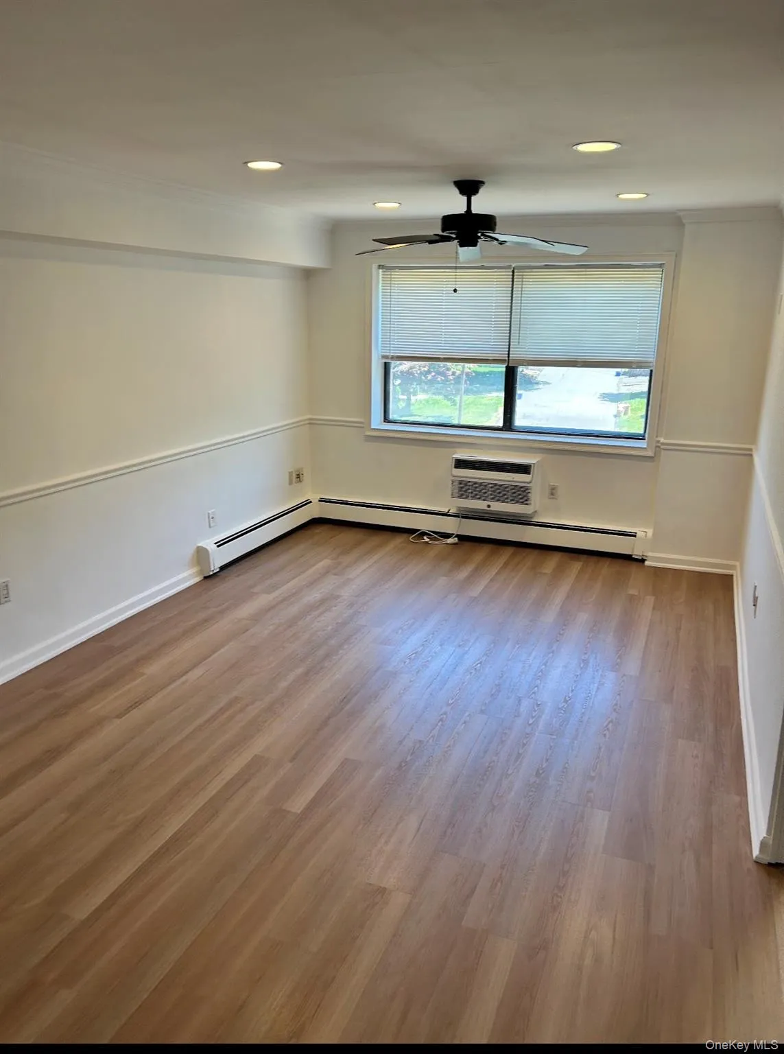 Living room nice size for your seating needs. New floor and fresh paint Living room nice size for your seating needs. New floor and fresh paint