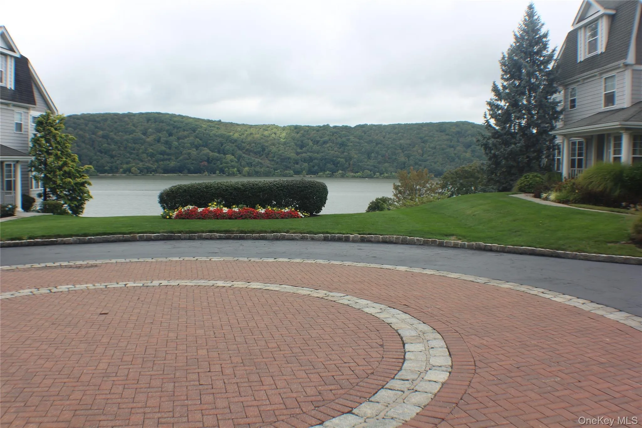 View of community with a yard, a water view, and a forest view View of community with a yard, a water view, and a forest view