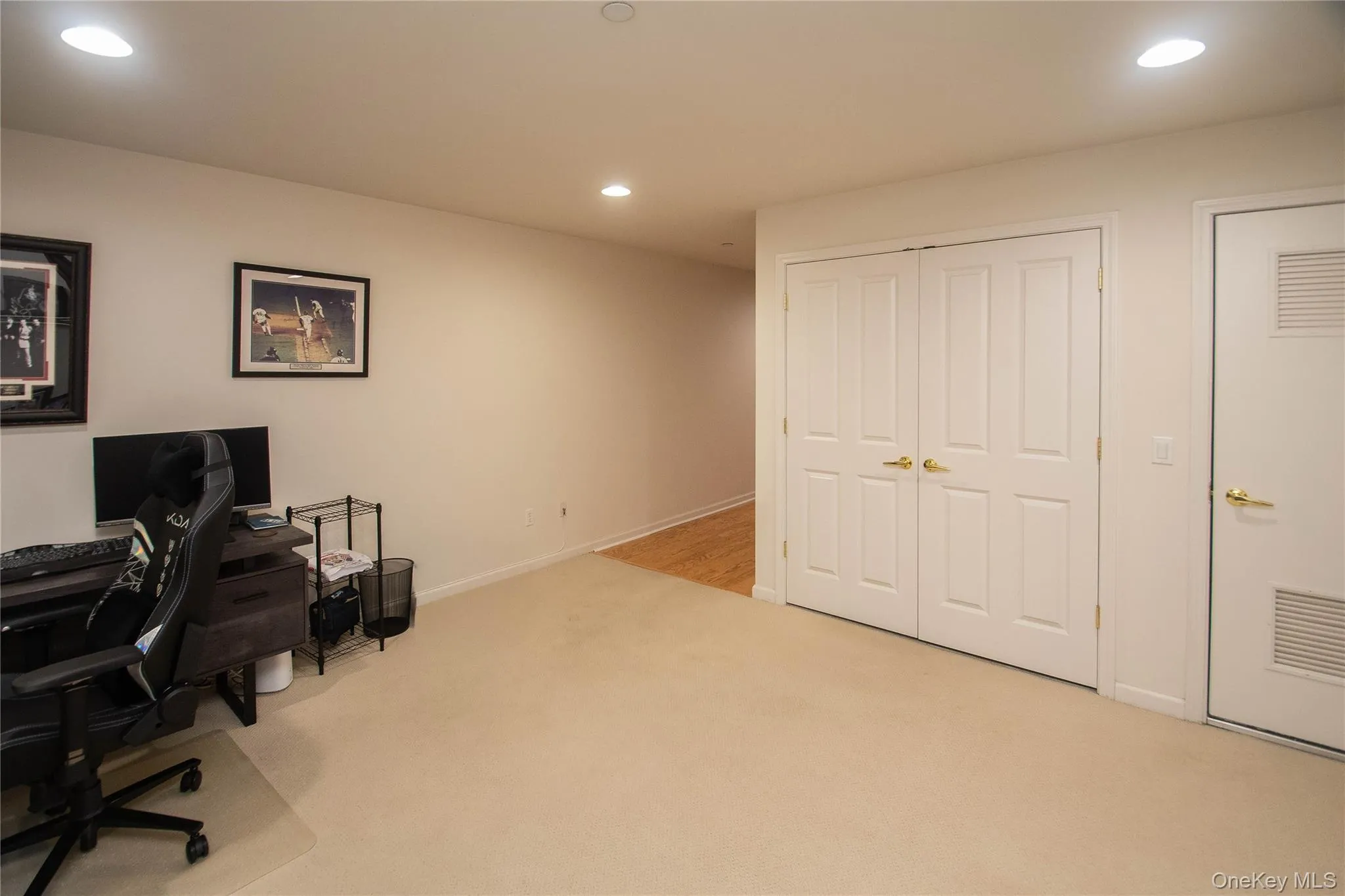 Office space with recessed lighting and light colored carpet Office space with recessed lighting and light colored carpet