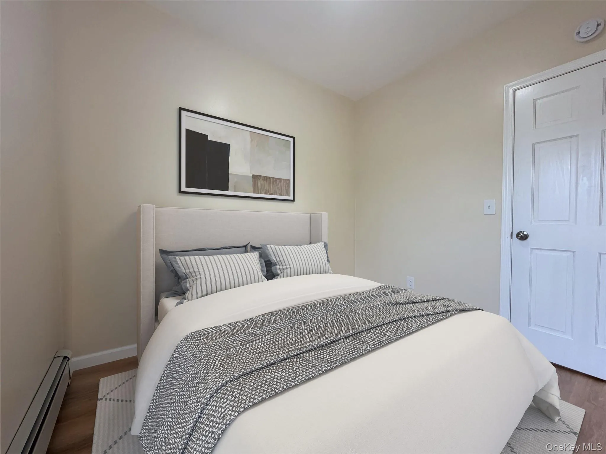 Neutral tone walls featuring wood-finish flooring Neutral tone walls featuring wood-finish flooring