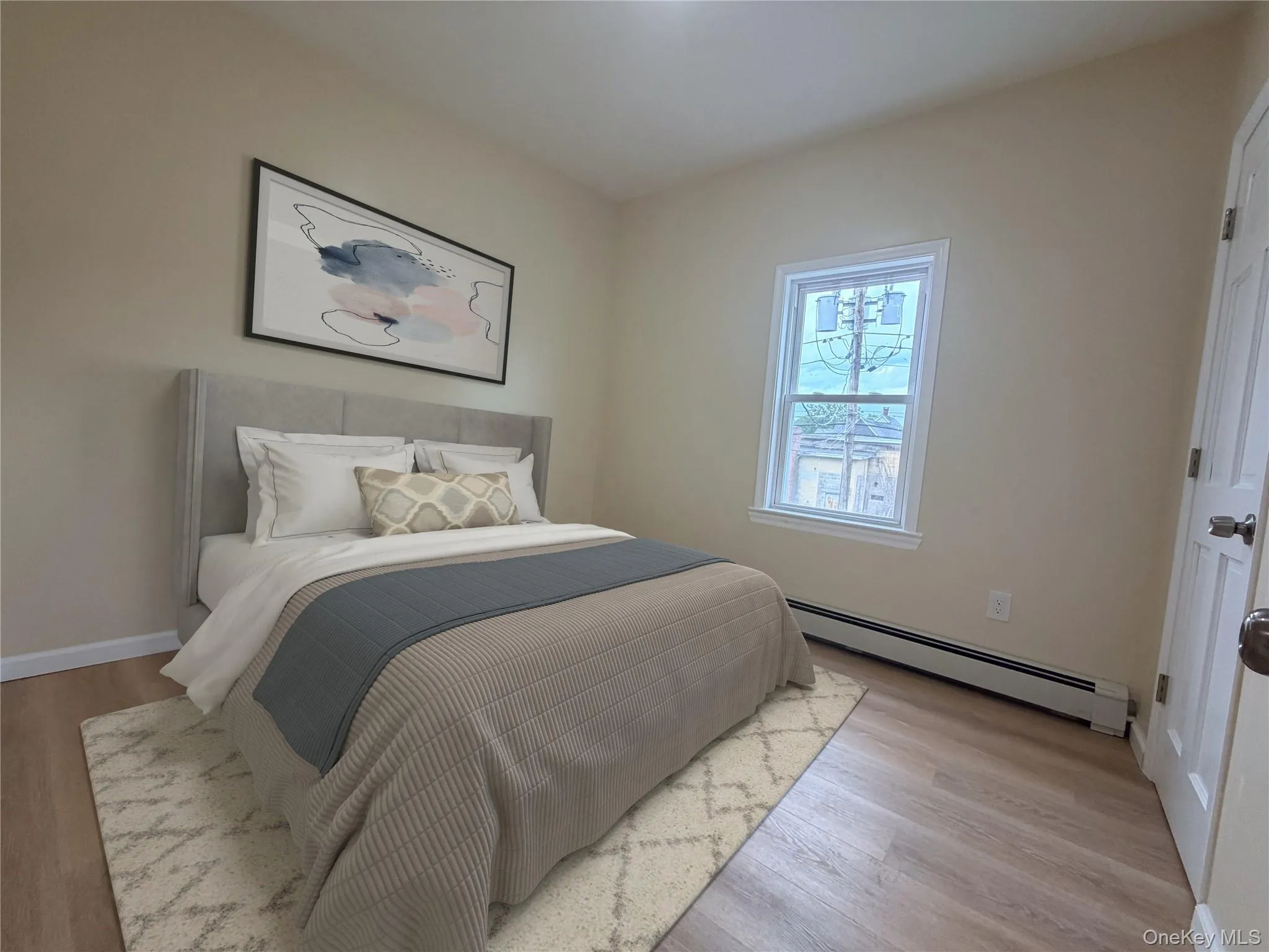 Bedroom with wood-finish flooring, a white window frame, baseboard heating, and light-colored wall paint Bedroom with wood-finish flooring, a white window frame, baseboard heating, and light-colored wall paint
