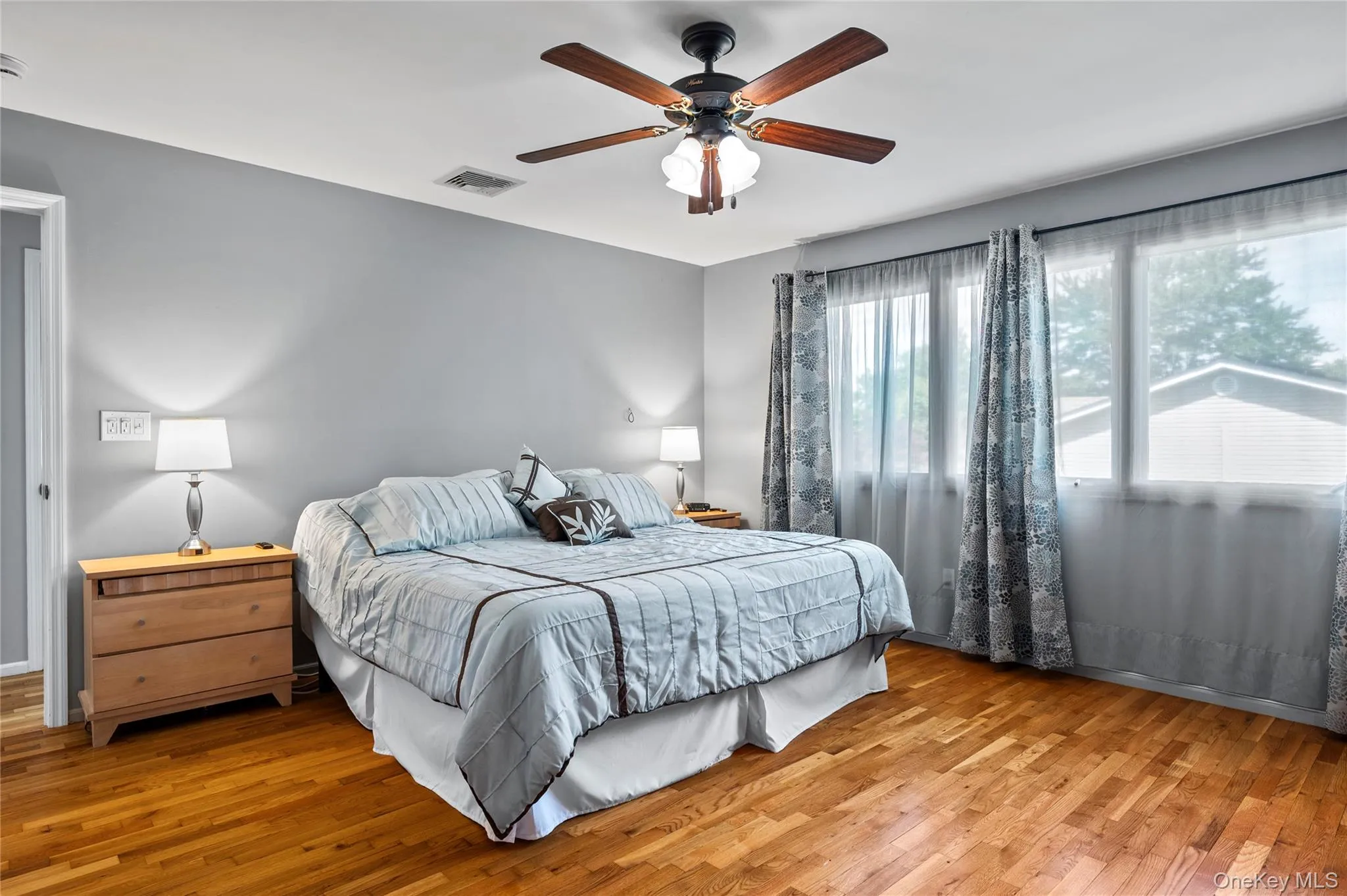 "House 1" Primary Bedroom with Hardwood Floors "House 1" Primary Bedroom with Hardwood Floors