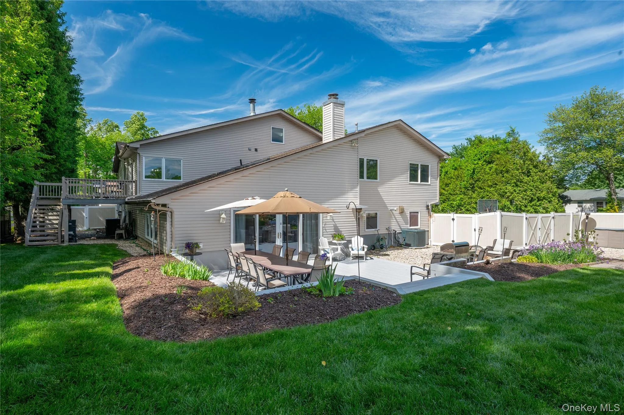 Rear of Property with Deck, Patio, and Yard Rear of Property with Deck, Patio, and Yard