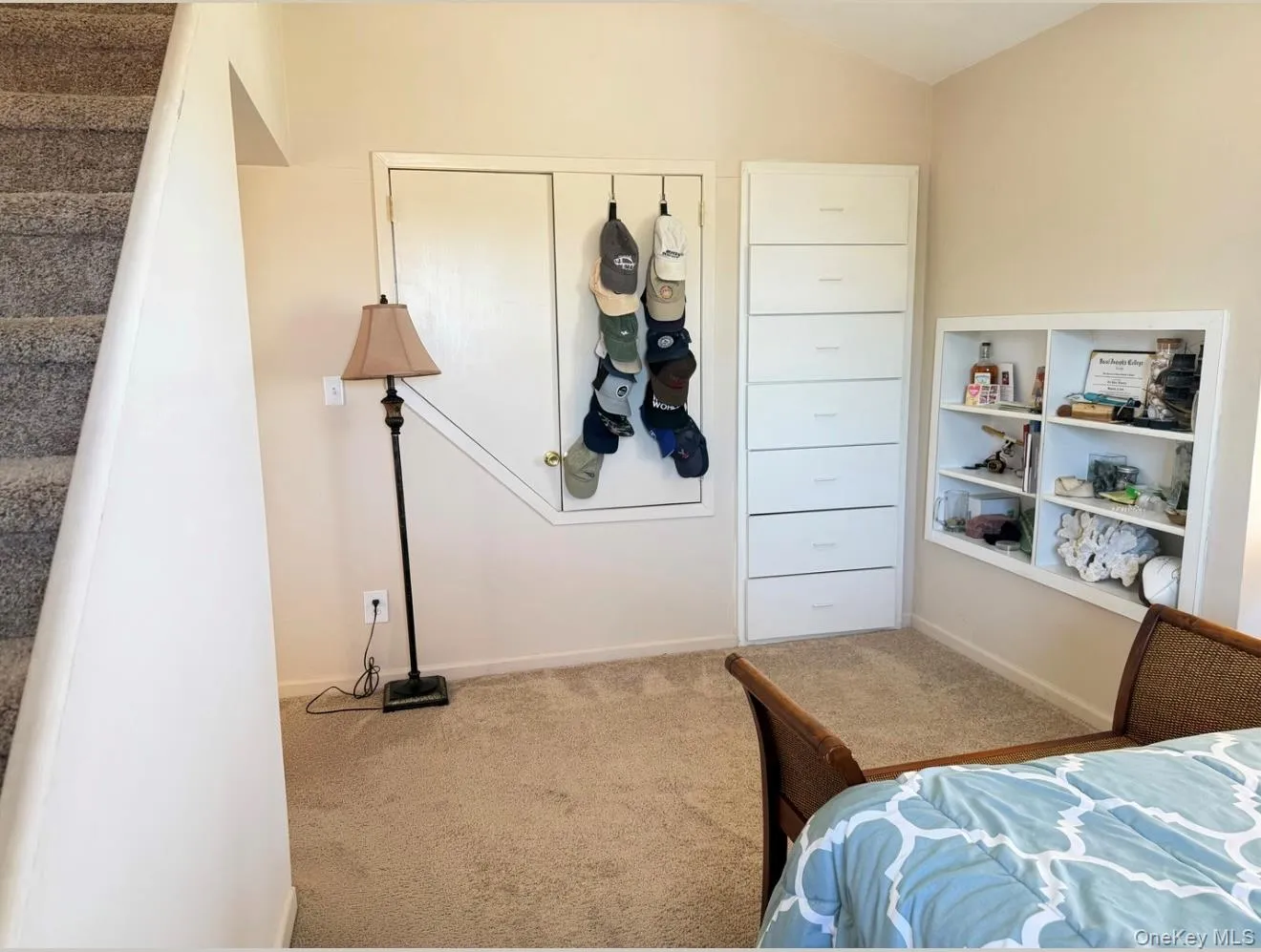 Carpeted flooring extending to a carpeted staircase Carpeted flooring extending to a carpeted staircase