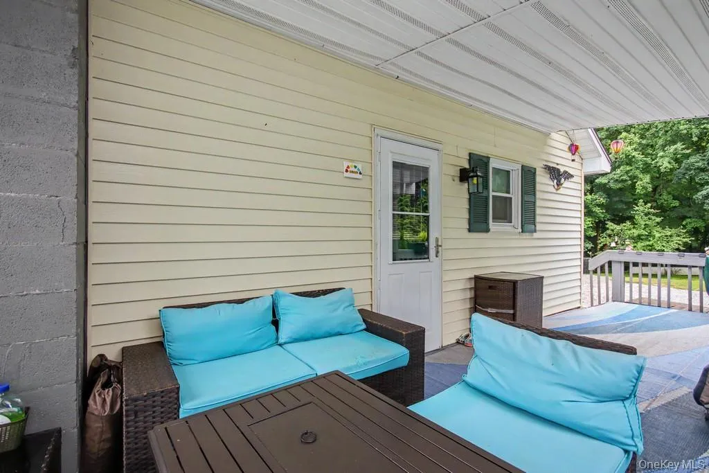 Partially covered side deck. Perfect spot to take in nature and relax! Partially covered side deck. Perfect spot to take in nature and relax!