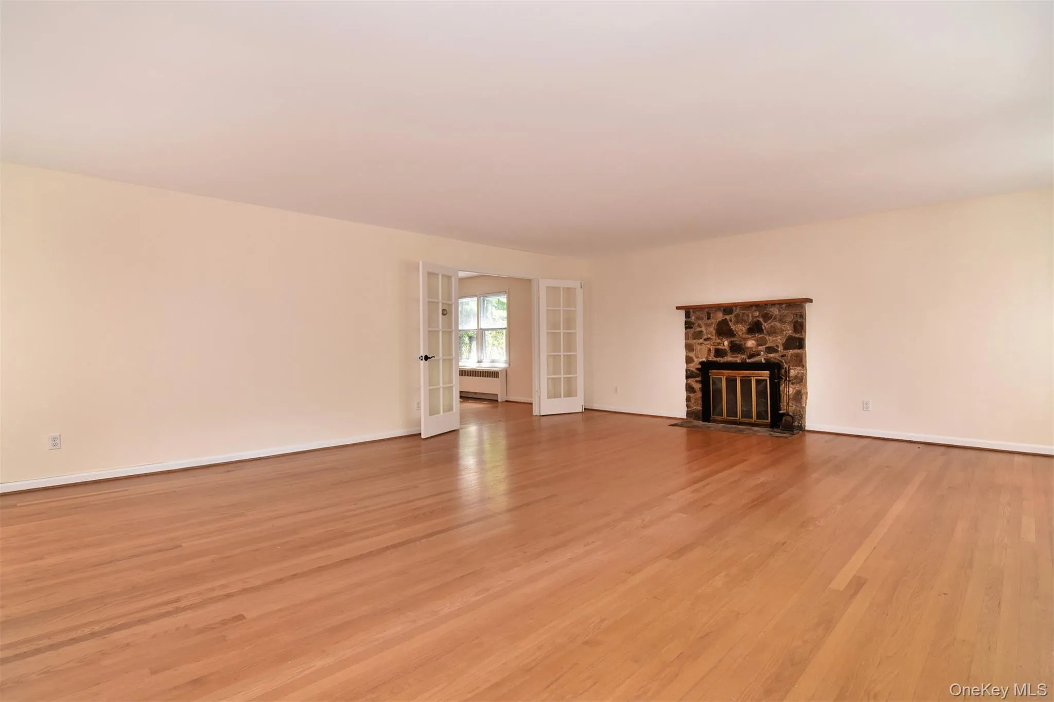 Living room with French doors to dining room. Living room with French doors to dining room.