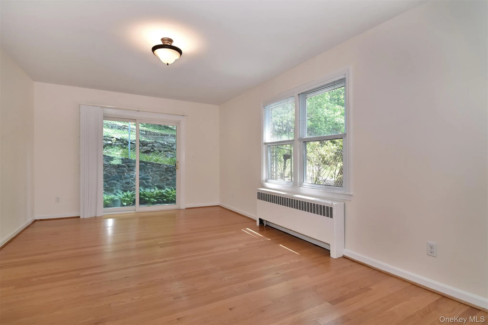 Full-size formal dining room with sliders out backyard. Full-size formal dining room with sliders out backyard.