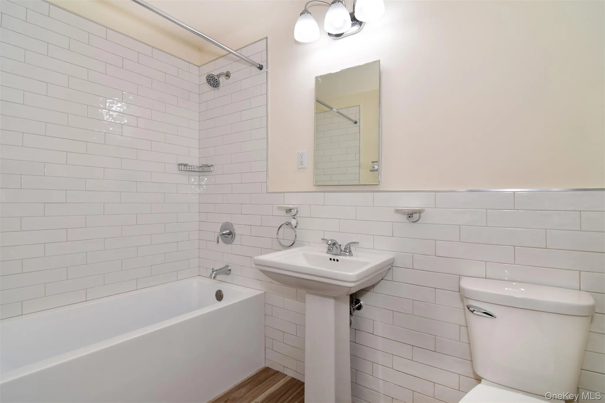 Brand new primary bath with subway tiles and new fixtures Brand new primary bath with subway tiles and new fixtures