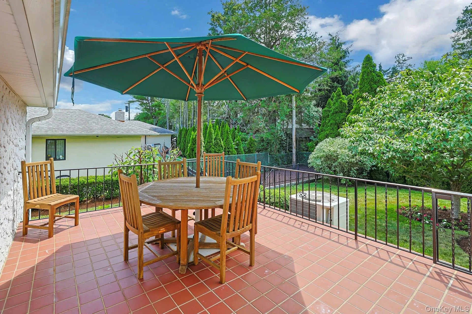 Upper patio off of dining room with access to garage Upper patio off of dining room with access to garage