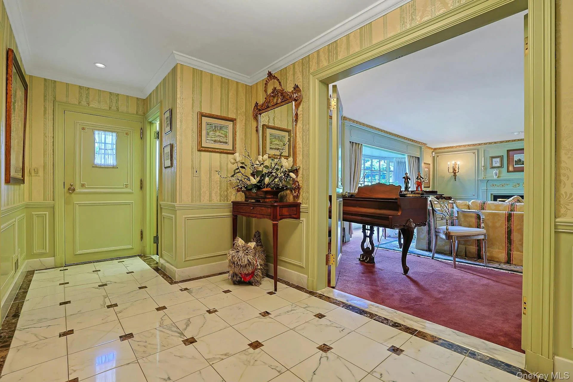 Entry foyer with powder room, coat closet, and stunning French doors leading to living room Entry foyer with powder room, coat closet, and stunning French doors leading to living room