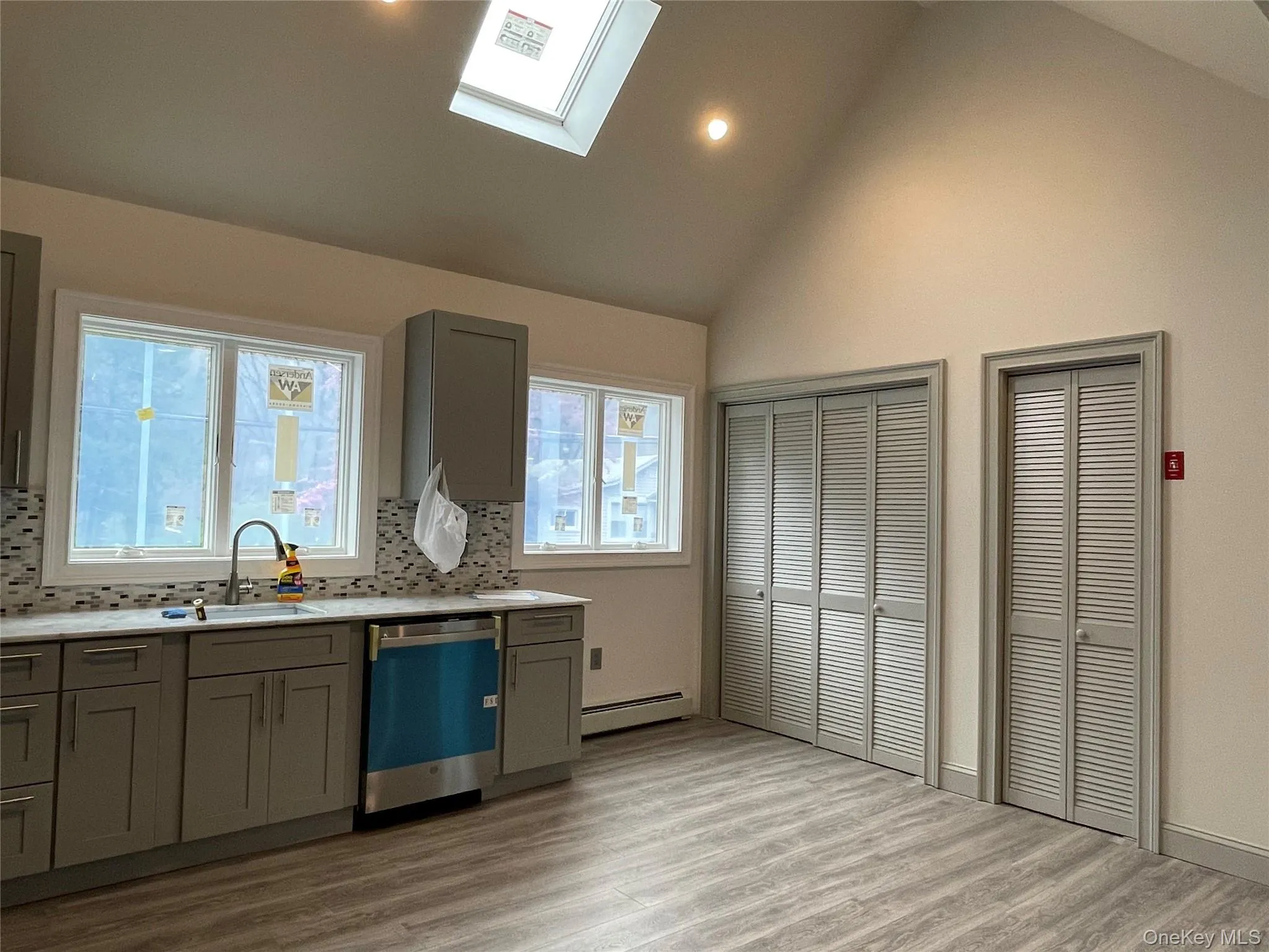 View of kitchen windows, sky light, recessed lighting and louver doors to laundry and utility rooms View of kitchen windows, sky light, recessed lighting and louver doors to laundry and utility rooms