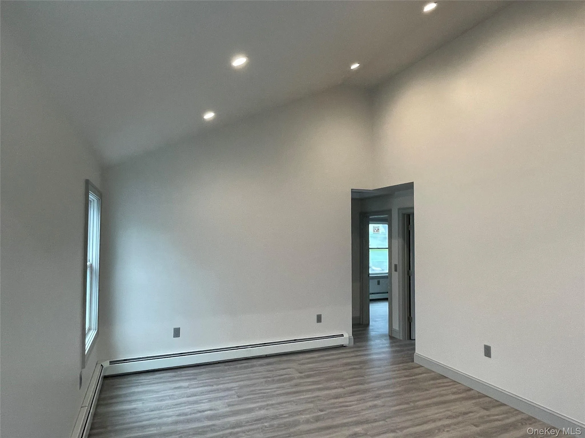 Valted ceiling and large windows give this room a bright airy feeling Valted ceiling and large windows give this room a bright airy feeling