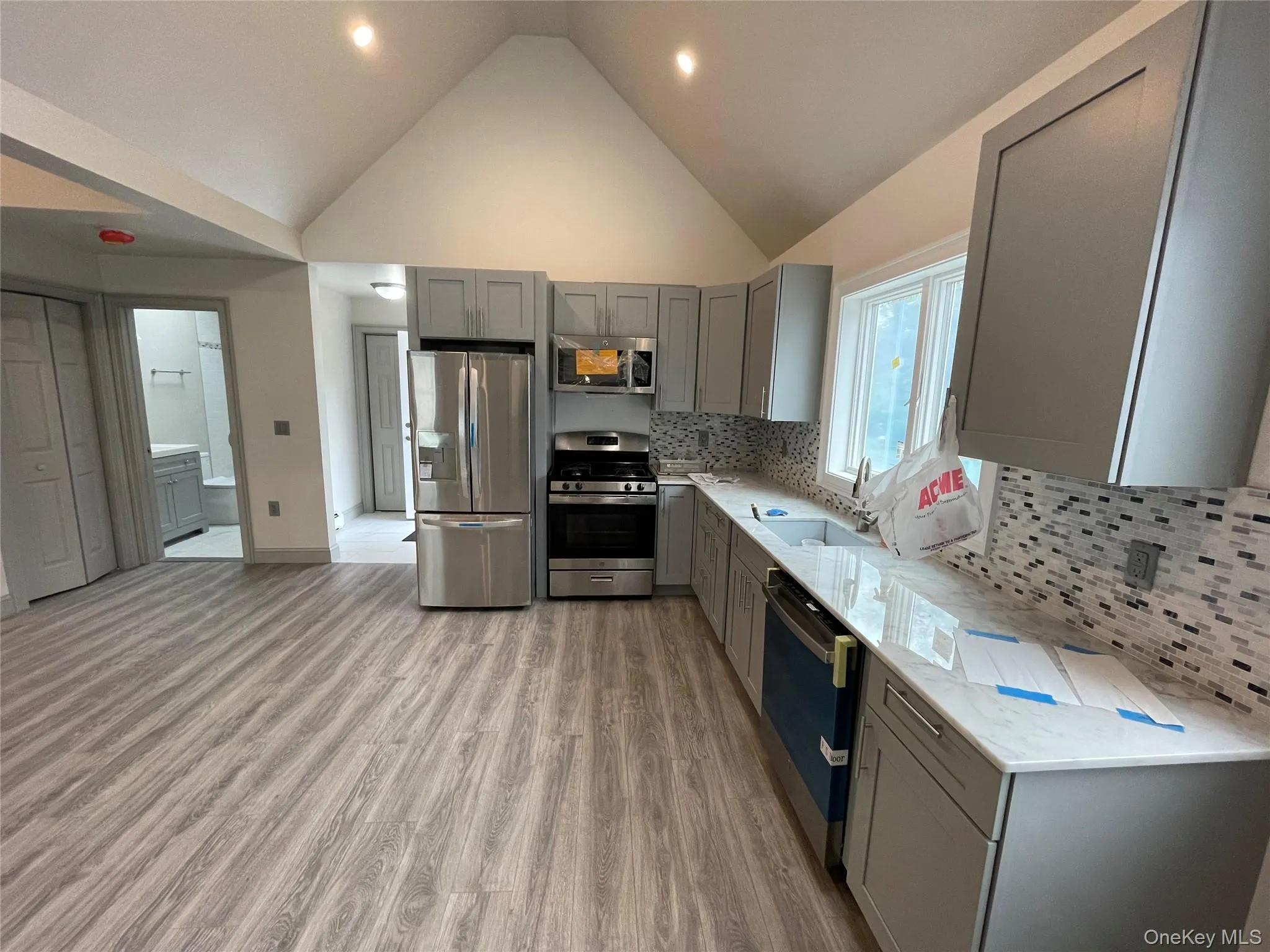 This angle shows large kitchen with ample counter spacecraft and cabinets. This angle shows large kitchen with ample counter spacecraft and cabinets.