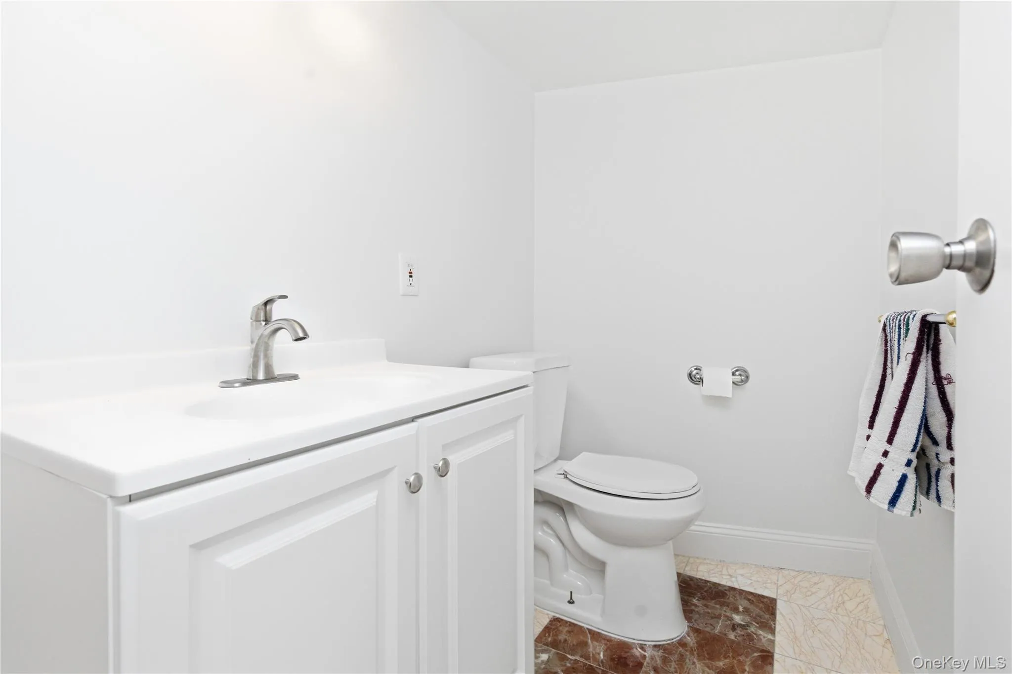 Convenient lower-level powder room with clean finishes and easy access from the recreation spaces. Convenient lower-level powder room with clean finishes and easy access from the recreation spaces.