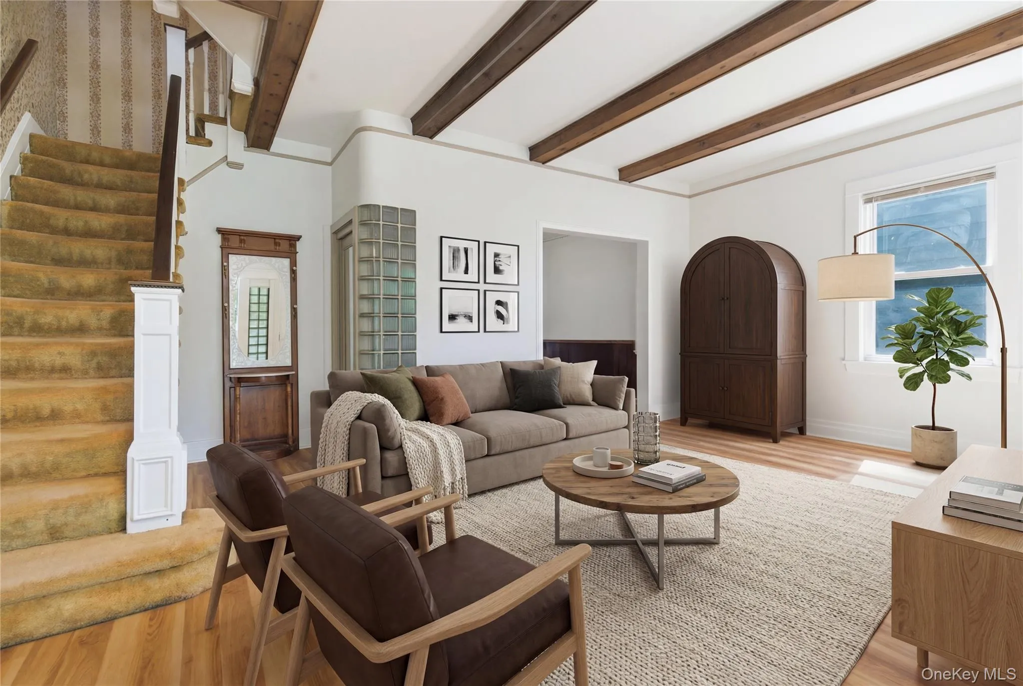 Expansive living room featuring exposed wood beams, gleaming floors, and an open, airy layout. Please note: this has been virtually staged. Expansive living room featuring exposed wood beams, gleaming floors, and an open, airy layout. Please note: this has been virtually staged.