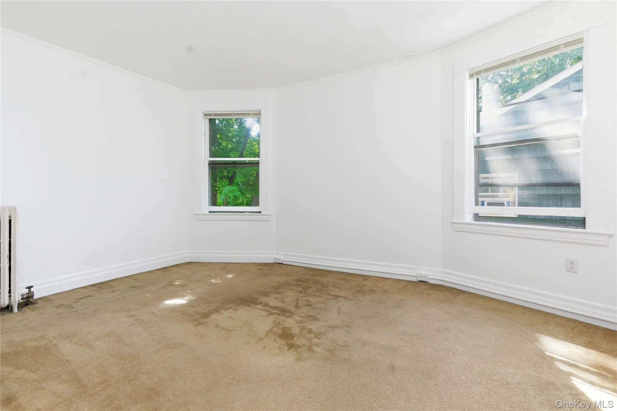 Comfortable secondary bedroom offering a versatile layout, large windows, and excellent natural light. Comfortable secondary bedroom offering a versatile layout, large windows, and excellent natural light.