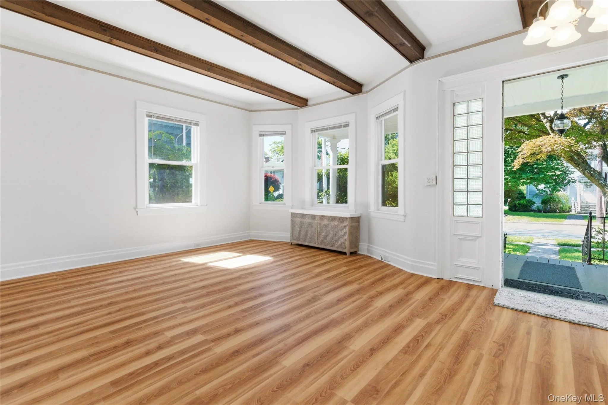 Sun-filled living space with walls of windows, beautiful natural light, and seamless indoor-outdoor connection. Sun-filled living space with walls of windows, beautiful natural light, and seamless indoor-outdoor connection.