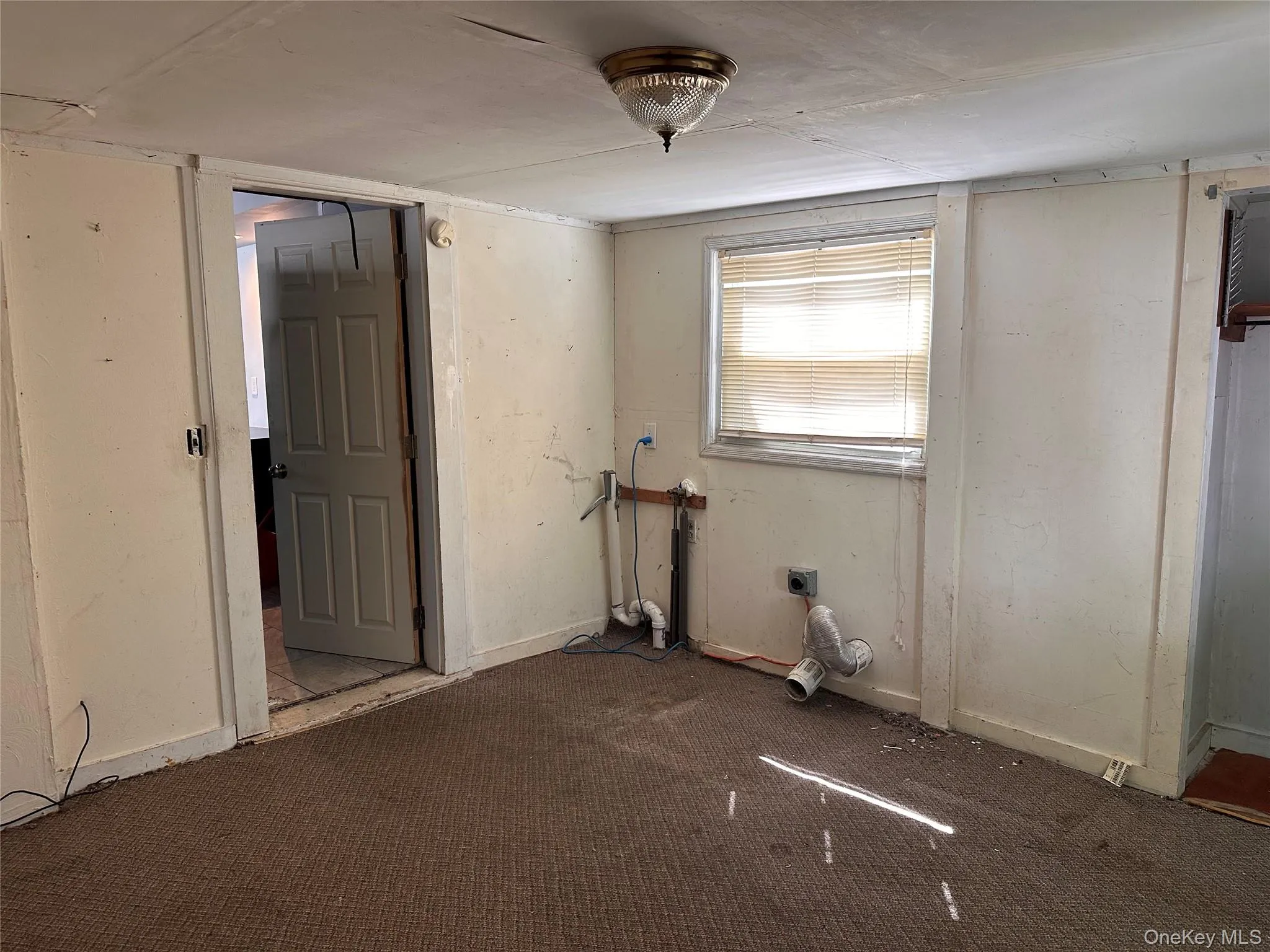 Enclosed porch with washer and dryer hookups. Enclosed porch with washer and dryer hookups.