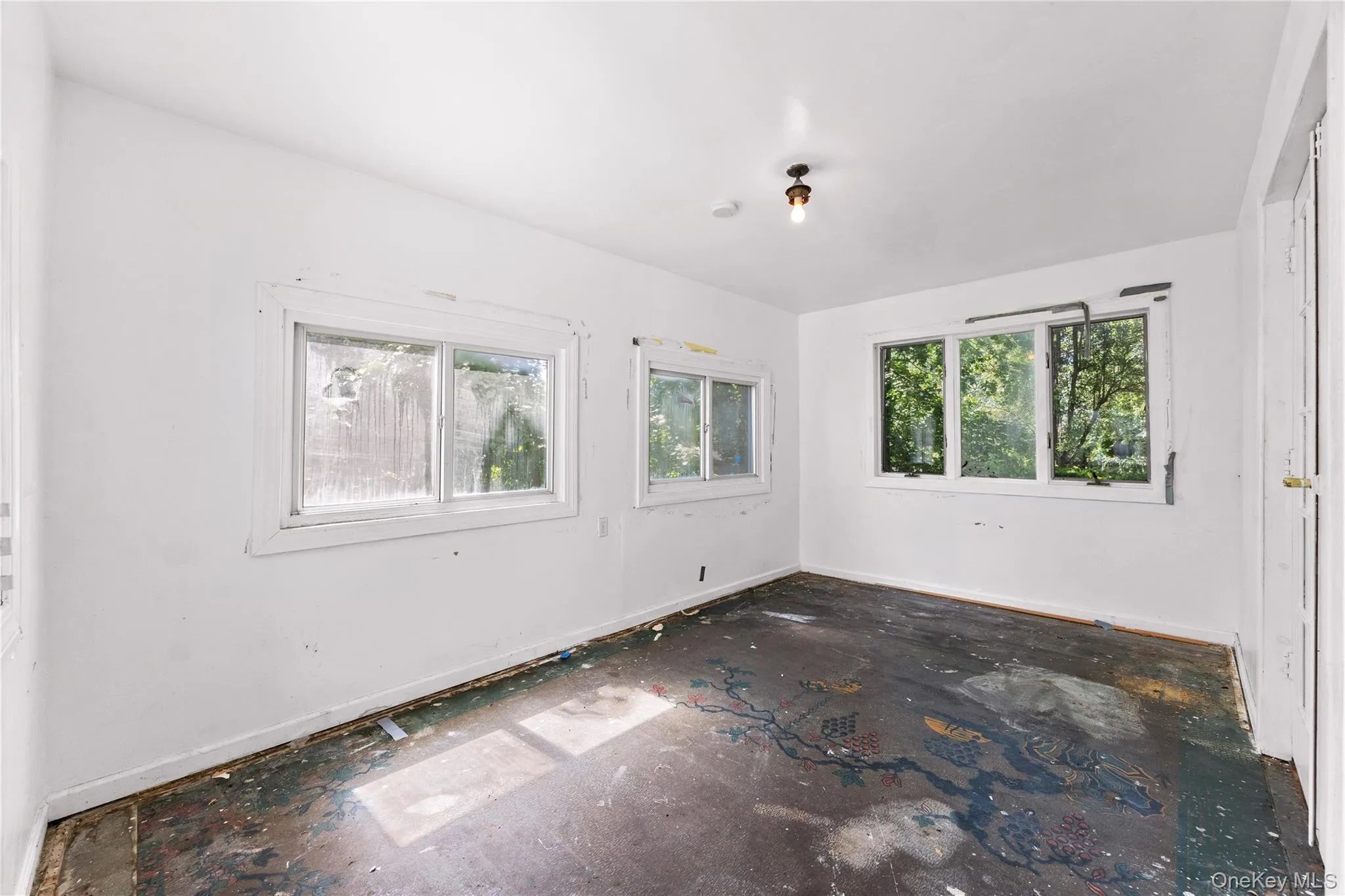 Unheated sunroom off living room. Unheated sunroom off living room.
