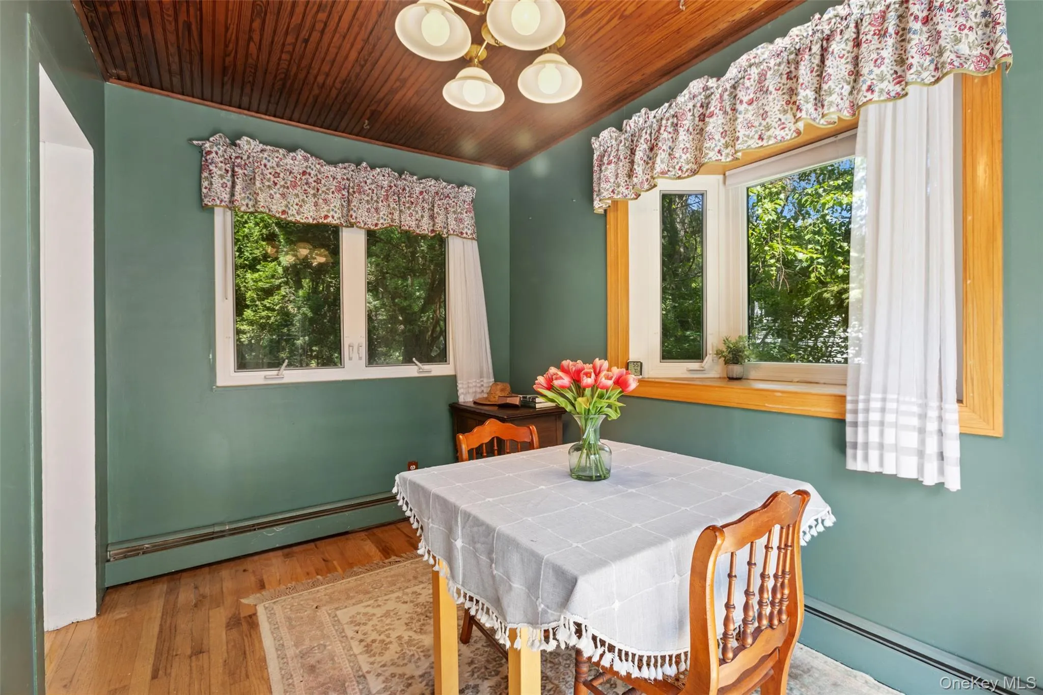 The triple pane bay window adds more light to the room The triple pane bay window adds more light to the room