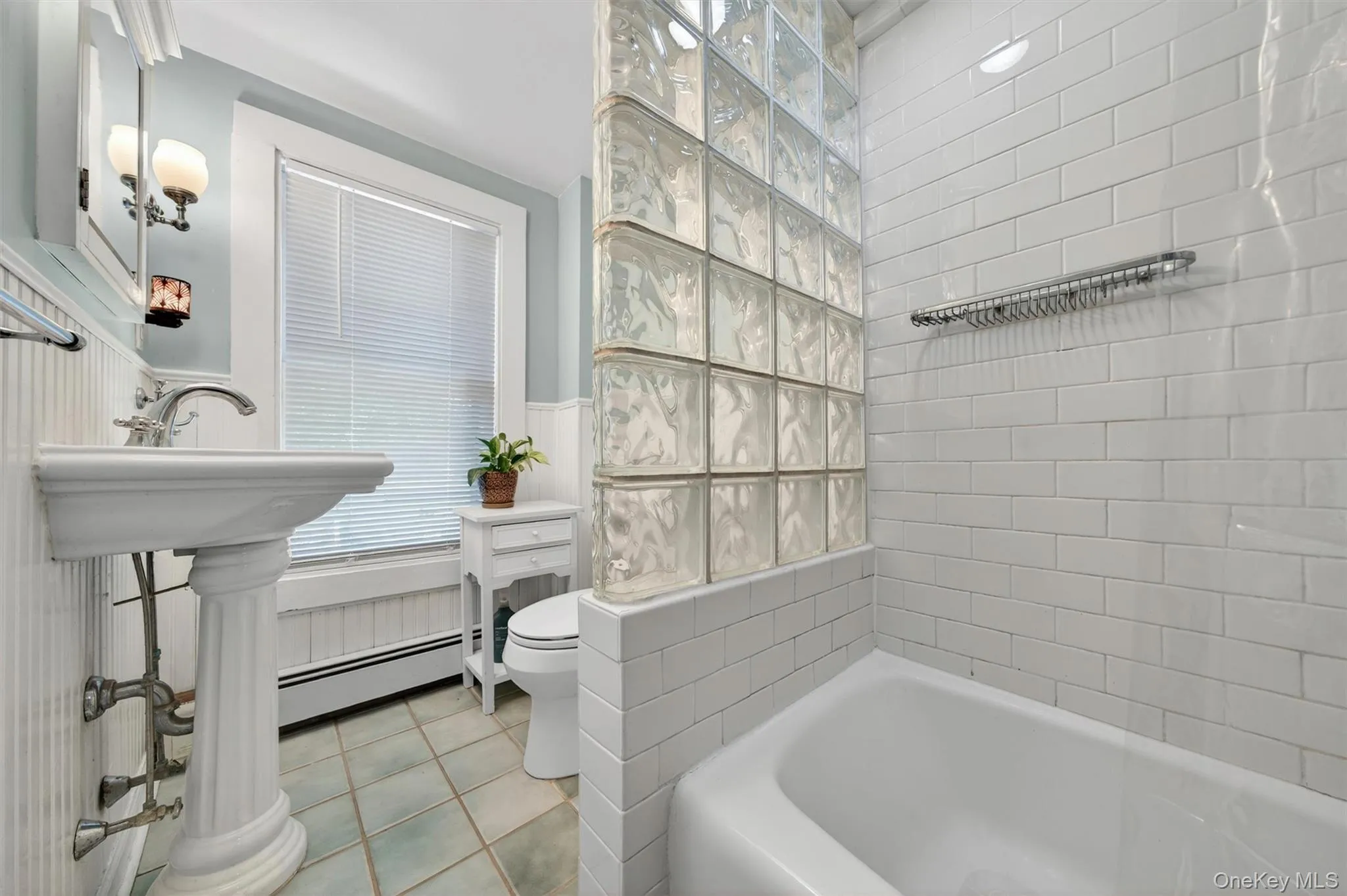The tempered glass block wall offers separation and gives a contemporary feel. The tempered glass block wall offers separation and gives a contemporary feel.