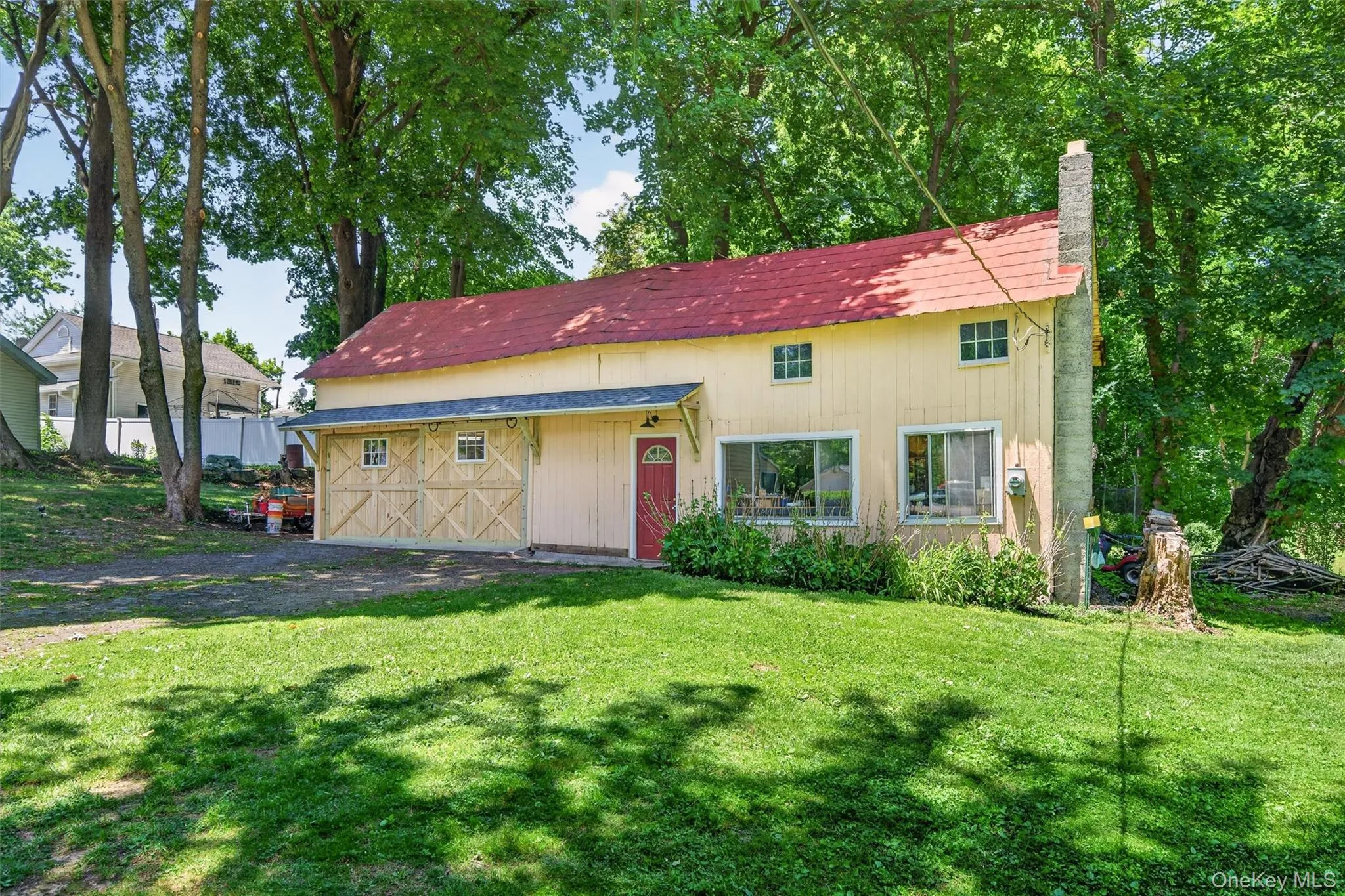 The barn has become a workshop one side and an oversized garage with a loft on the other. The barn has become a workshop one side and an oversized garage with a loft on the other.